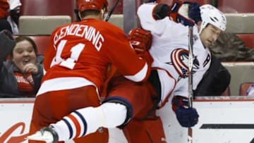Mar 12, 2015; Detroit, MI, USA; Detroit Red Wings right wing Luke Glendening (41) checks Columbus Blue Jackets defenseman Fedor Tyutin (51) in the third period at Joe Louis Arena. Columbus won 3-1. Mandatory Credit: Rick Osentoski-USA TODAY Sports