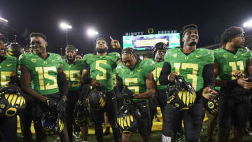 Sep 25, 2021; Eugene, Oregon, USA; Oregon Ducks wide receiver Jaylon Redd (6) and quarterback Anthony Brown (13) lead the team in a fight song after a game against the Arizona Wildcats at Autzen Stadium. The Ducks won the game 41-19. Mandatory Credit: Troy Wayrynen-USA TODAY Sports