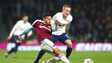 LONDON, ENGLAND - DECEMBER 22: Manuel Lanzini of West Ham United is challenged by Oliver Skipp of Tottenham Hotspur during the Carabao Cup Quarter Final match between Tottenham Hotspur and West Ham United at Tottenham Hotspur Stadium on December 22, 2021 in London, England. (Photo by Julian Finney/Getty Images)