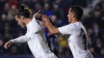 Real Madrid's Welsh forward Gareth Bale (L) celebrates with Real Madrid's Spanish midfielder Lucas Vazquez after scoring a goal during the Spanish league football match between Levante UD and Real Madrid CF at the Ciutat de Valencia stadium in Valencia on February 24, 2019. (Photo by JOSE JORDAN / AFP) (Photo credit should read JOSE JORDAN/AFP/Getty Images)