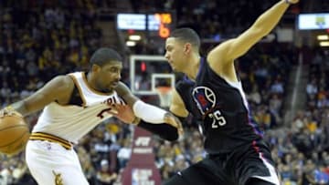 Jan 21, 2016; Cleveland, OH, USA; Los Angeles Clippers guard Austin Rivers (25) defends Cleveland Cavaliers guard Kyrie Irving (2) in the fourth quarter at Quicken Loans Arena. Mandatory Credit: David Richard-USA TODAY Sports
