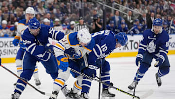 Mar 13, 2023; Toronto, Ontario, CAN; Buffalo Sabres forward Casey Mittelstadt (37) loses the puck to Toronto Maple Leafs defenseman Mark Giordano (55) and forward Calle Jarnkrok (19) and forward Michael Bunting (58) during the second period at Scotiabank Arena. Mandatory Credit: John E. Sokolowski-USA TODAY Sports