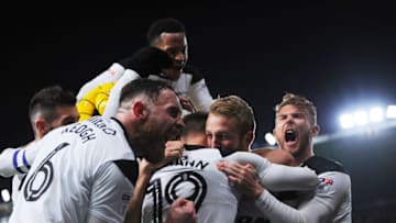 DERBY, ENGLAND - DECEMBER 02: Richard Keogh (L) and Sam Winnall (R) of Derby County celebrates with Johnny Russell after he scores the winning goal during the Sky Bet Championship match between Derby County and Burton Albion at iPro Stadium on December 2, 2017 in Derby, England. (Photo by Nathan Stirk/Getty Images)