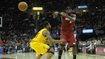 Mar 18, 2014; Cleveland, OH, USA; Miami Heat forward LeBron James (6) passes against Cleveland Cavaliers forward Alonzo Gee (33) in the first quarter at Quicken Loans Arena. Mandatory Credit: David Richard-USA TODAY Sports