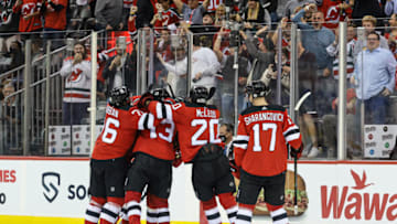Oct 15, 2021; Newark, New Jersey, USA; New Jersey Devils center Jack Hughes (86) celebrates his goal with teammates after the game against the Chicago Blackhawks at Prudential Center. Mandatory Credit: Vincent Carchietta-USA TODAY Sports
