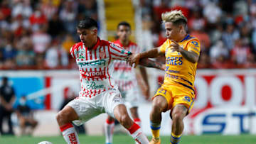 José Antonio Lopez (left) and Necaxa upset the Tigres, knocking them off the top of the Liga MX table. (Photo by Leopoldo Smith/Getty Images)