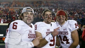 Nov 28, 2015; Stillwater, OK, USA; Oklahoma Sooners quarterback Baker Mayfield (6) and quarterback Trevor Knight (9) and quarterback Cody Thomas (14) celebrate after defeating Oklahoma State Cowboys at Boone Pickens Stadium. Oklahoma won 58-23. Mandatory Credit: Alonzo Adams-USA TODAY Sports