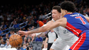 Apr 1, 2022; Oklahoma City, Oklahoma, USA; Oklahoma City Thunder forward Isaiah Roby (22) and Detroit Pistons guard Killian Hayes (7) reach for a loose ball Credit: Alonzo Adams-USA TODAY Sports