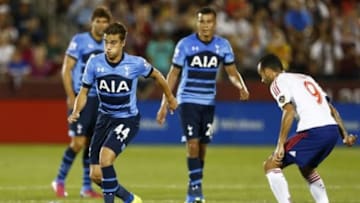 Jul 29, 2015; Denver, CO, USA; Tottenham Hotspur midfielder Harry Winks (44) plays the ball ahead of MLS All Stars midfielder Juninho (9) of the LA Galaxy during the second half of the 2015 MLS All Star Game at Dick