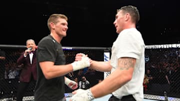 LIVERPOOL, ENGLAND - MAY 27: (R-L) Darren Till of England shakes hands with Stephen Thompson in their welterweight bout during the UFC Fight Night event at ECHO Arena on May 27, 2018 in Liverpool, England. (Photo by Josh Hedges/Zuffa LLC/Zuffa LLC via Getty Images)