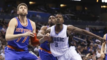 Feb 11, 2015; Orlando, FL, USA; New York Knicks center Andrea Bargnani (77) and Knicks guard Tim Hardaway Jr. try to hold back Orlando Magic center Dewayne Dedmon (3) during the fourth quarter at Amway Center. The Magic won 89-83. Mandatory Credit: Reinhold Matay-USA TODAY Sports