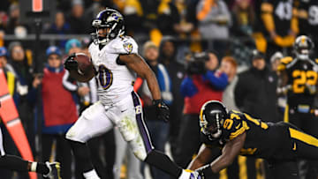 PITTSBURGH, PA - DECEMBER 25: Kenneth Dixon #30 of the Baltimore Ravens avoids a tackle by Lawrence Timmons #94 of the Pittsburgh Steelers at Heinz Field on December 25, 2016 in Pittsburgh, Pennsylvania. (Photo by Joe Sargent/Getty Images) *** Local Caption ***