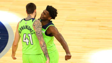 Juancho Hernangomez of the Minnesota Timberwolves celebrates with teammate Anthony Edwards. (Photo by Harrison Barden/Getty Images)