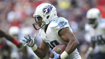 Nov 30, 2014; Houston, TX, USA; Tennessee Titans running back Bishop Sankey (20) rushes during the first quarter against the Houston Texans at NRG Stadium. Mandatory Credit: Troy Taormina-USA TODAY Sports