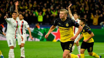 Dortmund's Norwegian forward Erling Braut Haaland (C) celebrates after scoring the 1-0 during the UEFA Champions League Last 16, first-leg football match BVB Borussia Dortmund v Paris Saint-Germain (PSG) in Dortmund, western Germany, on February 18, 2020. (Photo by Ina Fassbender / AFP) (Photo by INA FASSBENDER/AFP via Getty Images)