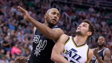 Feb 25, 2016; Salt Lake City, UT, USA; Utah Jazz guard Raul Neto (25) drives to the basket against San Antonio Spurs center Boris Diaw (33) during the first half at Vivint Smart Home Arena. Mandatory Credit: Russ Isabella-USA TODAY Sports