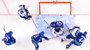 VANCOUVER, BC - NOVEMBER 19: Winnipeg Jets center Mark Scheifele (55) scores a goal on Vancouver Canucks goaltender Jacob Markstrom (25) during their NHL game at Rogers Arena on November 19, 2018 in Vancouver, British Columbia, Canada. Winnipeg won 6-3. (Photo by Derek Cain/Icon Sportswire via Getty Images)