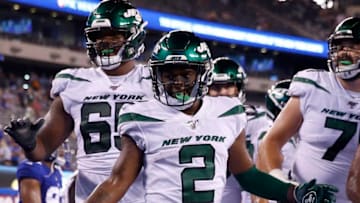 EAST RUTHERFORD, NEW JERSEY - AUGUST 08: Greg Dortch #2 of the New York Jets celebrates his touchdown with teammates Charone Peake #17 and Ben Braden #69 in the fourth quarter against the New York Giants during a preseason matchup at MetLife Stadium on August 08, 2019 in East Rutherford, New Jersey. (Photo by Elsa/Getty Images)