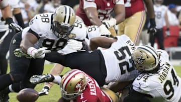 November 6, 2016; Santa Clara, CA, USA; San Francisco 49ers quarterback Colin Kaepernick (7) fumbles the football against defensive tackle Sheldon Rankins (98), outside linebacker Craig Robertson (52), and defensive end Cameron Jordan (94) during the fourth quarter at Levi