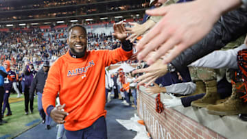 Auburn footballNov 19, 2022; Auburn, Alabama, USA; Auburn Tigers interim head coach Carnell Williams celebrates with fans after the Tigers beat the Western Kentucky Hilltoppers at Jordan-Hare Stadium. Mandatory Credit: John Reed-USA TODAY Sports