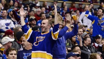Dec 13, 2014; Denver, CO, USA; St. Louis Blues fans react to a power play in the third period against the Colorado Avalanche at the Pepsi Center. The Blues defeated the Avalanche 3-2 in a overtime period. Mandatory Credit: Ron Chenoy-USA TODAY Sports