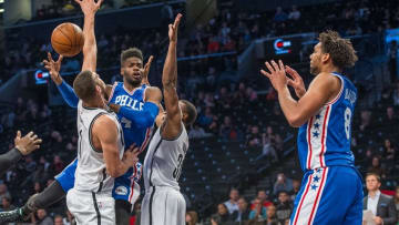 Oct 18, 2015; Brooklyn, NY, USA; Philadelphia 76ers center Nerlens Noel (4) passes the ball to Philadelphia 76ers center Jahlil Okafor (8) with Brooklyn Nets center Brook Lopez (11) and Brooklyn Nets small forward Thaddeus Young (30) defending during the 2nd qtr at Barclays Center. The Nets won 92-91. Mandatory Credit: Gregory J. Fisher-USA TODAY Sports