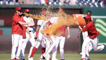 WASHINGTON, DC - SEPTEMBER 06: Carter Kieboom #8 of the Washington Nationals is doused with gatorade by Erick Fedde #23 after driving in the game winning run with a single in the ninth inning against the New York Mets at Nationals Park on September 06, 2021 in Washington, DC. (Photo by G Fiume/Getty Images)