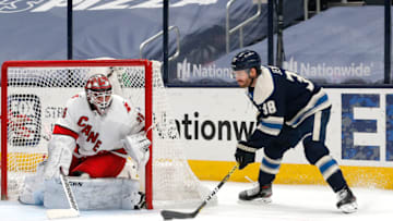 Mar 25, 2021; Columbus, Ohio, USA; Columbus Blue Jackets center Boone Jenner (38) moves in for a shot against Carolina Hurricanes goalie Alex Nedeljkovic (39) during the first period at Nationwide Arena. Mandatory Credit: Russell LaBounty-USA TODAY Sports