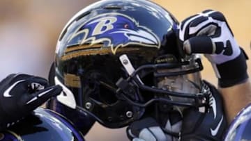 Oct 20, 2013; Pittsburgh, PA, USA; Baltimore Ravens helmet in a team huddle before the game against the Pittsburgh Steelers at Heinz Field. Mandatory Credit: Charles LeClaire-USA TODAY Sports