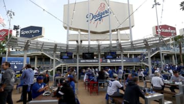 LOS ANGELES, CALIFORNIA - OCTOBER 11: Fans drink beverages before game 3 of the National League Division Series between the Los Angeles Dodgers and the San Francisco Giants at Dodger Stadium on October 11, 2021 in Los Angeles, California. (Photo by Ronald Martinez/Getty Images)