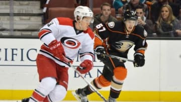 Dec 11, 2015; Anaheim, CA, USA; Carolina Hurricanes left wing Jeff Skinner (53) moves the puck while defended by Anaheim Ducks center Rickard Rakell (67) in the first period during an NHL hockey game at the Honda Center. Mandatory Credit: Kirby Lee-USA TODAY Sports