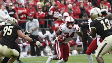 Oct 31, 2015; West Lafayette, IN, USA; Nebraska Cornhuskers running back Terrell Newby (34) runs between Purdue Boilermakers defensive end Evan Panfil (95) and defensive end Gelen Robinson (13) in the first half at Ross Ade Stadium. Mandatory Credit: Sandra Dukes-USA TODAY Sports