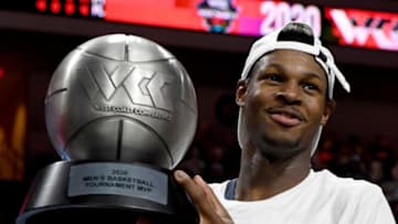 LAS VEGAS, NEVADA - MARCH 10: Joel Ayayi #11 of the Gonzaga Bulldogs holds up the most outstanding player award after the Bulldogs defeated the Saint Mary's Gaels 84-66 to win the championship game of the West Coast Conference basketball tournament at the Orleans Arena on March 10, 2020 in Las Vegas, Nevada. (Photo by Ethan Miller/Getty Images)