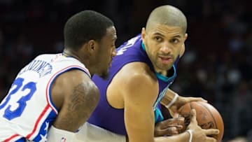 Mar 29, 2016; Philadelphia, PA, USA; Charlotte Hornets guard Nicolas Batum (5) controls the ball against Philadelphia 76ers forward Robert Covington (33) during the second quarter at Wells Fargo Center. Mandatory Credit: Bill Streicher-USA TODAY Sports