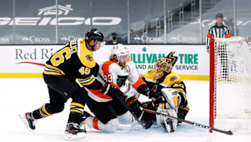 BOSTON, MASSACHUSETTS - JANUARY 21: Tuukka Rask #40 of the Boston Bruins saves a shot on goal from Jakub Voracek #93 of the Philadelphia Flyers during overtime at TD Garden on January 21, 2021 in Boston, Massachusetts. The Bruins defeat the Flyers 5-4. (Photo by Maddie Meyer/Getty Images)