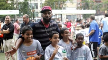 Jun 26, 2013; New York, NY, USA; New York Knicks player Baron Davis poses with young fans for a photo just prior to the Steve Nash Foundation Showdown Mandatory Credit: Andy Marlin-USA TODAY Sports