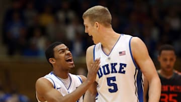Duke basketball teammates Quinn Cook and Mason Plumlee (Photo by Streeter Lecka/Getty Images)