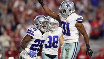 GLENDALE, AZ - SEPTEMBER 25: Free safety Byron Jones #31 of the Dallas Cowboys reacts with safety Xavier Woods #25 of the Dallas Cowboys (Photo by Christian Petersen/Getty Images)