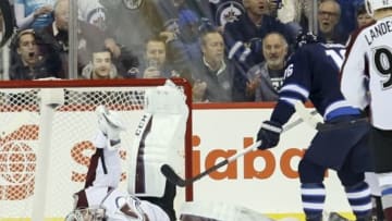 Dec 5, 2014; Winnipeg, Manitoba, CAN; Winnipeg Jets forward Bryan Little (not pictured) scores as Colorado Avalanche goalie Semyon Varlamov (1) tries to make a save during the first period at MTS Centre. Mandatory Credit: Bruce Fedyck-USA TODAY Sports