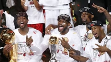Jun 20, 2013; Miami, FL, USA; Miami Heat shooting guard Dwyane Wade (left), LeBron James (center) and Chris Bosh (right) celebrate after game seven in the 2013 NBA Finals at American Airlines Arena. Miami defeated the San Antonio Spurs 95-88 to win the NBA Championship. Mandatory Credit: Derick E. Hingle-USA TODAY Sports