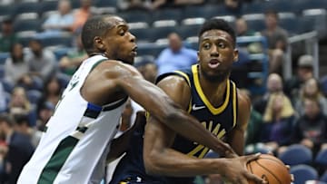 MILWAUKEE, WI - OCTOBER 04: Thaddeus Young #21 of the Indiana Pacers is fouled by Khris Middleton #22 of the Milwaukee Bucks during the second half of a preseason game at the BMO Harris Bradley Center on October 4, 2017 in Milwaukee, Wisconsin. NOTE TO USER: User expressly acknowledges and agrees that, by downloading and or using this photograph, User is consenting to the terms and conditions of the Getty Images License Agreement. (Photo by Stacy Revere/Getty Images)