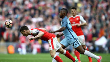 LONDON, ENGLAND - APRIL 23: Laurent Koscielny of Arsenal heads the ball in front of Kelechi Iheanacho of Manchester City during the Emirates FA Cup Semi-Final match between Arsenal and Manchester City at Wembley Stadium on April 23, 2017 in London, England. (Photo by Julian Finney/Getty Images,)