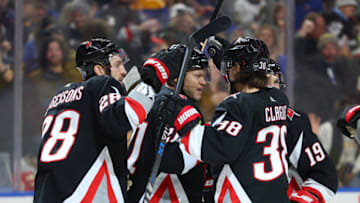Dec 29, 2022; Buffalo, New York, USA; Buffalo Sabres right wing Kyle Okposo (21) celebrates his goal with teammates during the second period against the Detroit Red Wings at KeyBank Center. Mandatory Credit: Timothy T. Ludwig-USA TODAY Sports