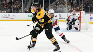 Oct 6, 2021; Boston, Massachusetts, USA; Boston Bruins left wing Erik Haula (56) looks to pass the puck in front of Washington Capitals defenseman Justin Schultz (2) during the second period at the TD Garden. Mandatory Credit: Brian Fluharty-USA TODAY Sports
