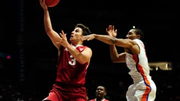Mar 10, 2016; Nashville, TN, USA; Arkansas Razorbacks guard Dusty Hannahs (3) shoots over Florida Gators guard KeVaughn Allen (4) during game 2 of the SEC tournament at Bridgestone Arena. Florida Gators won 68-61. Mandatory Credit: Joshua Lindsey-USA TODAY Sports