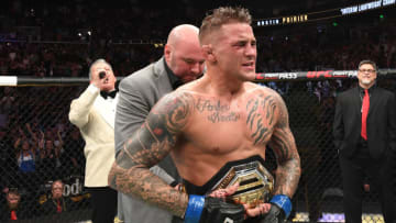 ATLANTA, GA - APRIL 13: (L-R) UFC President Dana White places the interim lightweight championship belt on Dustin Poirier after defeating Max Holloway in their interim lightweight championship bout during the UFC 236 event at State Farm Arena on April 13, 2019 in Atlanta, Georgia. (Photo by Josh Hedges/Zuffa LLC/Zuffa LLC via Getty Images)