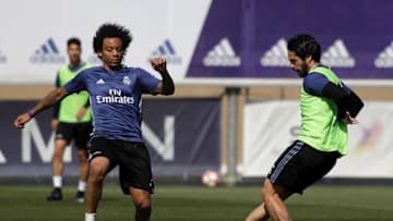 MADRID, SPAIN - APRIL 14: Isco (R) and Marcelo of Real Madrid in action during a training session at Valdebebas training ground on April 14, 2017 in Madrid, Spain. (Photo by Angel Martinez/Real Madrid via Getty Images)