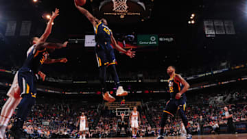 PHOENIX, AZ - OCTOBER 25: Donovan Mitchell #45 of the Utah Jazz grabs the rebound against the Phoenix Suns on October 25, 2017 at Talking Stick Resort Arena in Phoenix, AZ. Copyright 2017 NBAE (Photo by Barry Gossage/NBAE via Getty Images)