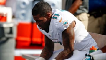 Oct 20, 2013; Miami Gardens, FL, USA; Miami Dolphins wide receiver Mike Wallace (11) on the bench in the fourth quarter against the Buffalo Bills at Sun Life Stadium. The Bills won 23-21. Mandatory Credit: Robert Mayer-USA TODAY Sports