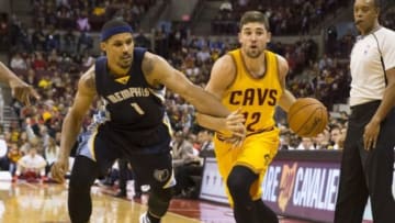Oct 12, 2015; Columbus, OH, USA; Memphis Grizzlies forward Jarnell Stokes (1) ties up the arm of Cleveland Cavaliers guard Joe Harris (12) at the Schottenstein Center. Memphis won 91-81. Mandatory Credit: Greg Bartram-USA TODAY Sports
